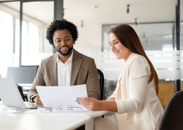 Two translators compare Haitian Creole and English side by side for accuracy in Haitian Creole Translation Services.