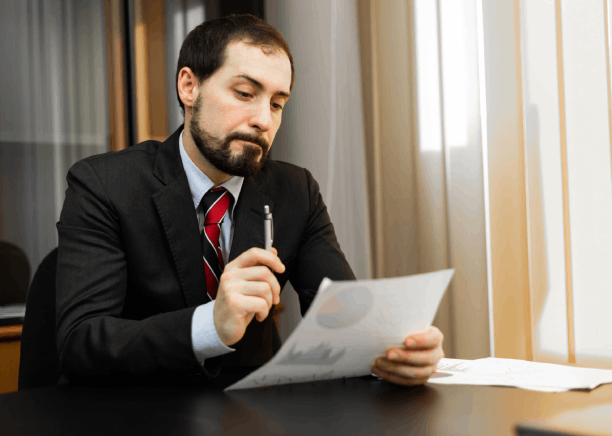 A business manager reviews a certified contract translation at a desk, using Translation Services in Pembroke Pines.