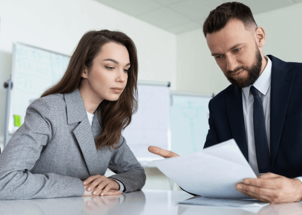 Business partners review a bilingual contract as Chinese translation services in Florida support clear terms for a new deal.