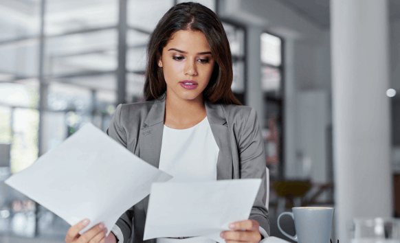 A Florida linguist types certified pages and reviews headphones audio for Haitian Creole Translation Services in Florida.