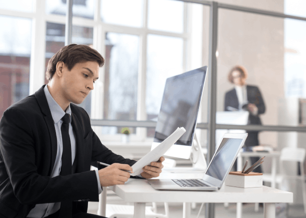 A translator checks a birth certificate in a secure office, delivering Portuguese Translation Services in Florida.