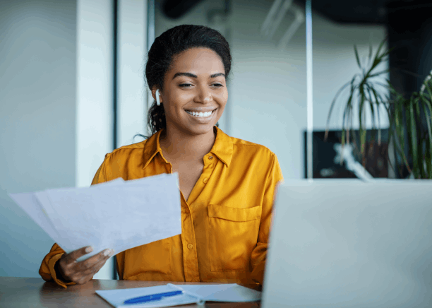 A Florida marketing manager reviews a brochure with Haitian Creole Translation Services in Florida to match brand tone.
