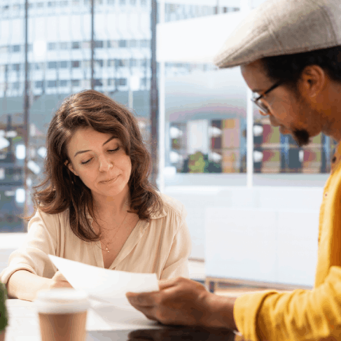 Translator checks an individual birth certificate, providing Spanish Translation Services in Florida for accurate.