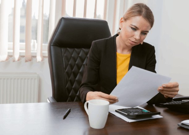 A project manager reviews industry-specific files for Translation Services in Hollywood, tailoring language solutions.