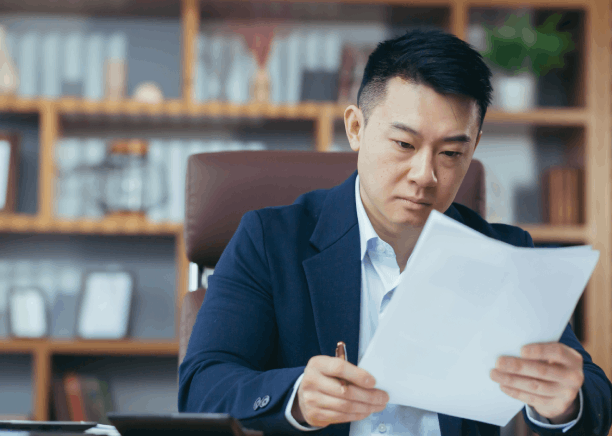A translator reviews USCIS forms at a Florida desk, providing Chinese translation services in Florida for legal filings.