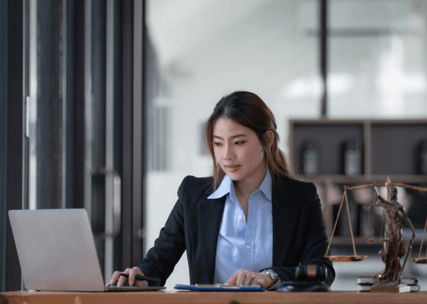 Lawyer compares a French contract with an English version, providing French Translation Services in Florida.