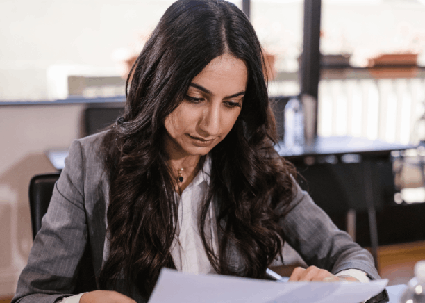 A certified linguist checks a Florida contract, delivering Spanish Translation Services in Florida for precise legal wording.