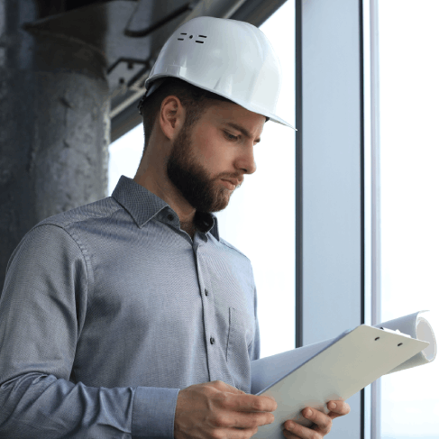 An engineer reviews a translated equipment manual, using Translation Services in Pembroke Pines for technical and industry.
