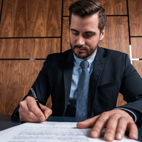 A specialist checks translated court forms against originals on a laptop, using Translation Services in Hollywood for legal.