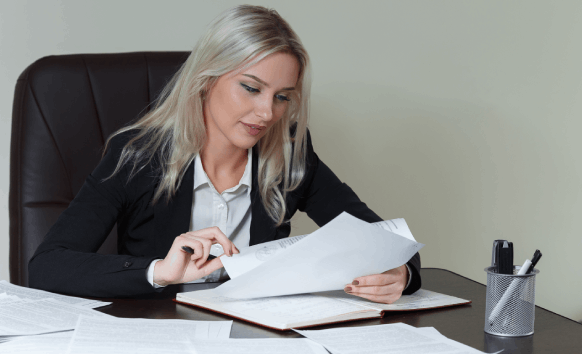 A translator reviews a business legal contract at a desk, showing Translation Services in Pembroke Pines for accurate.