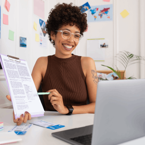 A client organizes translated supporting documents for a USCIS filing, guided by Haitian Creole Translation Services.